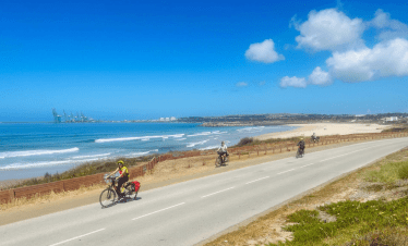Group of cyclists near Portugal coast